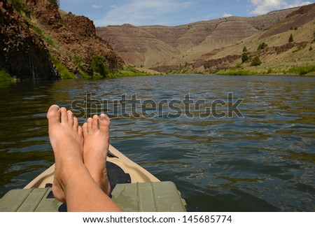 relaxing on a kayak in a beautiful landscape in oregon with mountains