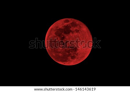 blood moon concept of a red full moon against a black sky