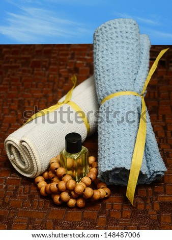 aromatherapy outdoors at spa with wash cloths and essential oil