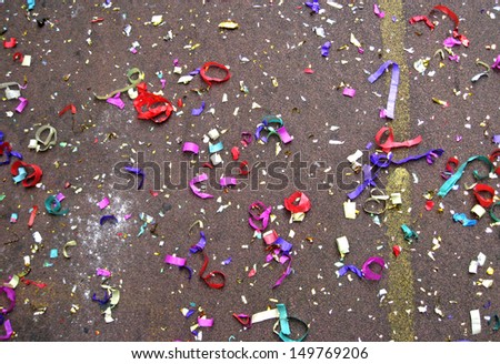 Colorful confetti in street after Chinese New Year parade