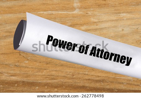 legal power of attorney document on wood background