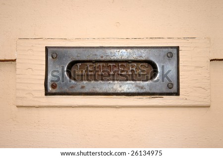 Old rusted letters mail slot in door