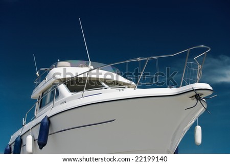 Side view of a yacht under deep blue sky