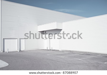 White industrial architecture - Outdoor view of a white faded store architecture