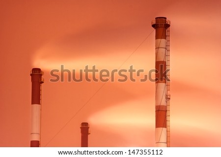 smokestack tubes on sky background. air pollution problem