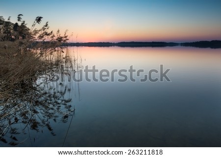 Beautiful lake landscape at sunset. Beautiful polish lake photographed in Mazury lake district.