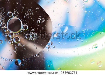 Abstract background of oil droplets on water surface. Beautiful and colorful macro abstraction