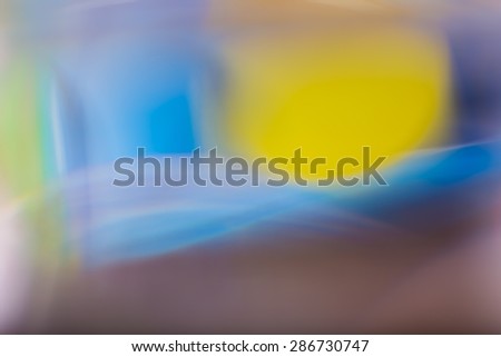 Abstract background of color reflections in thick glass vase. Macro abstract background