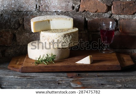 Goat cheese maturing in basement. Studio shoot with mystic light effect.