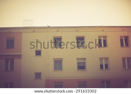Vintage photo of block of flats abstraction. Close up of moder building