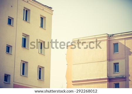 Vintage photo of block of flats abstraction. Close up of modern building