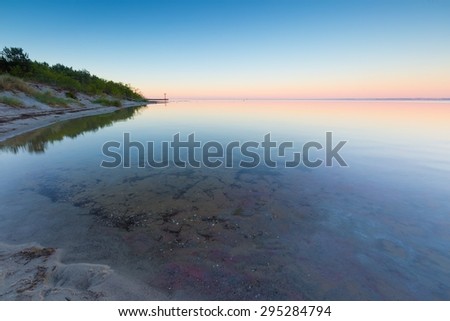 Beautiful seascape of Bay before sunrise. Calm place in Jastarnia in Poland, Gdanska bay.