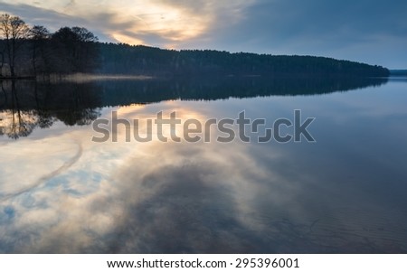 Sunrise over beautiful wild lake in Poland. Lake in Mazury Lake District in northern Poland