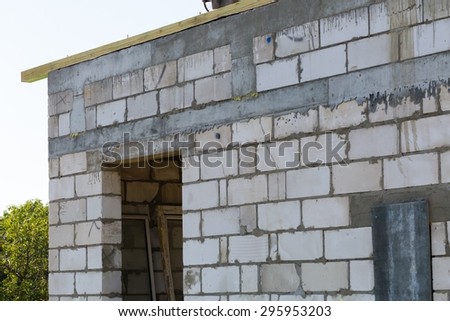 Unfinished home in polish countryside. Unfinished building of white bricks.