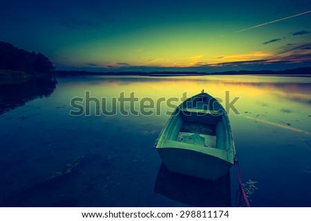 Vintage photo of beautiful lake sunset. Polish lake in Mazury lake district. Polish lake landscape