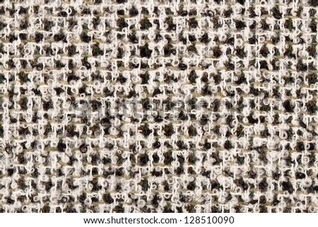Detail of coarse cloth in soft lighting with elements of beige, white and brown
