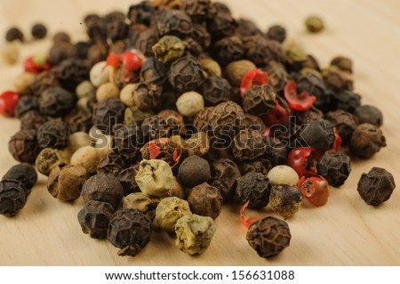 Colored Peppers Mix on the wood background