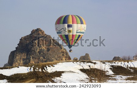 Goreme,Cappadocia Turkey - February 25, 2012: Hot air balloon just about to land to the ground after finishing of its flying over Cappadocia area in the early morning