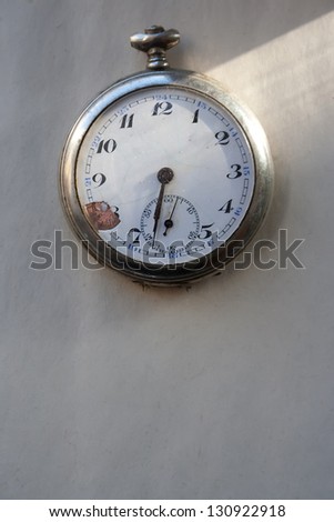 Old pocket watch on paper. Minute, time runs concept.
