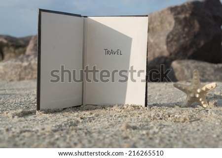 Travel - Inscription on the Book. Travel Concept. Beach background.
