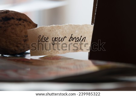 Use your brain, hand lettering,  book and walnut