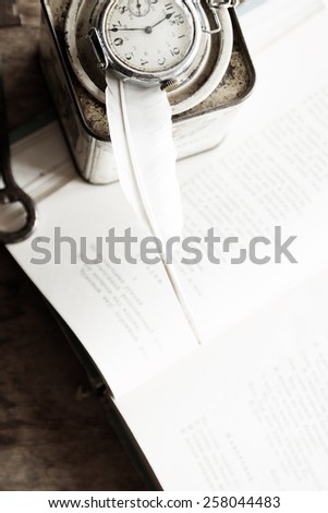 Poetry, poet, writing poems idea. Books, poems and feather. Soft Focus, Toned.  vintage.