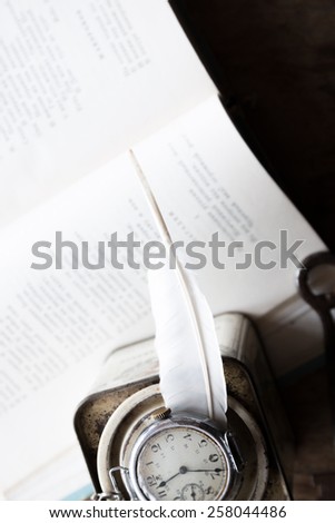 Poetry, poet, writing poems idea. Books, poems and feather.