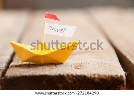 travel background  with free text space, paper boat and an inscription