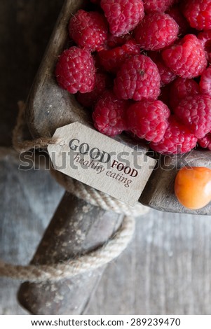 Good food healthy Eating tag with the inscription and raspberries