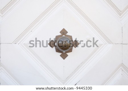 door handle on a white door, close-up