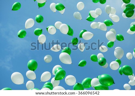Green and white balloons in the sky. Balloons in the sky. Ã�Â¡elebration