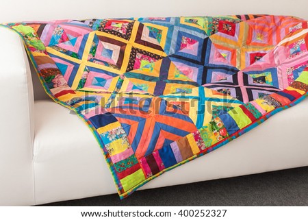 Patchwork quilt. Part of patchwork quilt as background. Flower print. Color blanket in style patchwork. Color blanket.  Handmade.