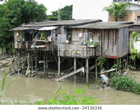 Shanty town in Manaus Amazonia, Brazil.  A favela is a specifically portuguese word for a shanty town. The Wooden houses built on high stilts called palafitas (Photo taken 01/30/2009)
