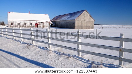 Winter fields with old barn, Quebec, Canada