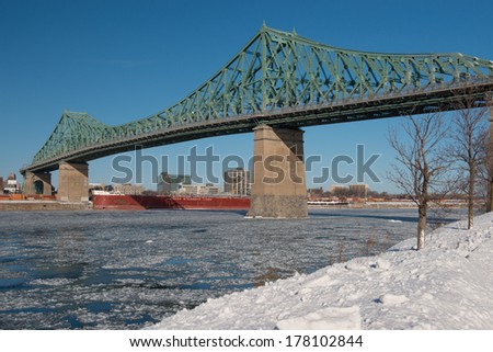 MONTREAL - FEBRUARY 16:The Jacques Cartier Bridge is a steel truss cantilever bridge crossing the Saint Lawrence River in Montreal,Qc on February 16h,2014.It opened to traffic on May 14, 1930