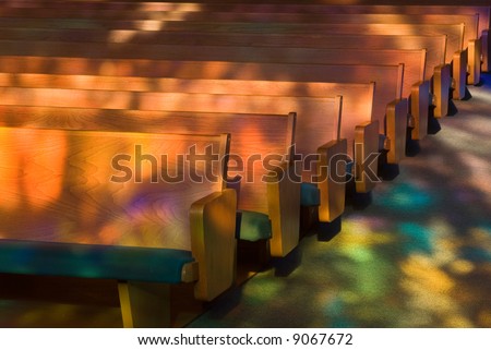 Empty church pews with Heavenly Light.