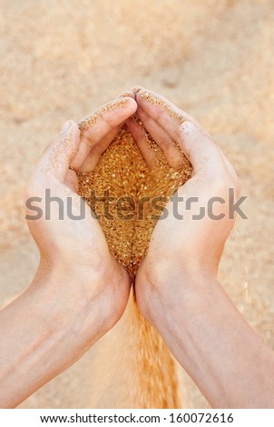 Man with sand in hands