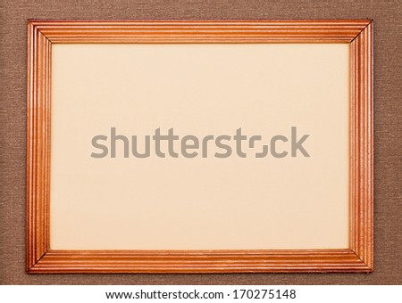 Old wooden frame with cotton canvas and paper inside