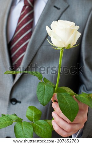 Man with a white rose