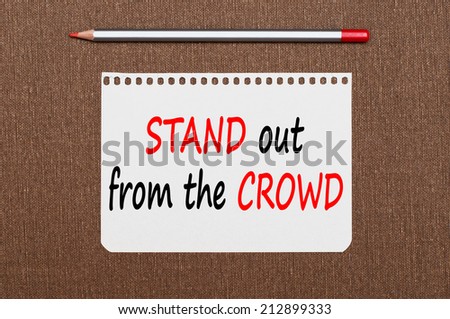 Stand out from the crowd concept. Business message text wording on the note paper