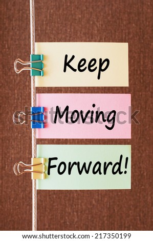 Keep Moving Forward ! Motivational message text written on note papers