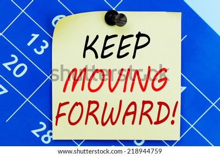 Keep Moving Forward ! Motivational message text written on note paper