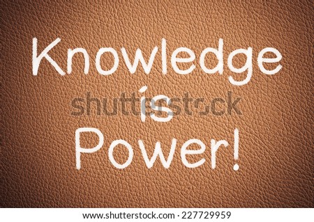 Knowledge is power written on a brown leather texture