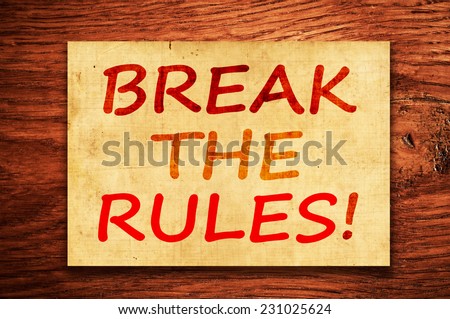 Break the Rules! written on a grunge paper