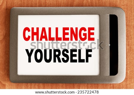 Challenge Yourself written in e-book - Business or Education Concept