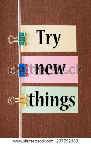 Try New Things written on a colorful papers