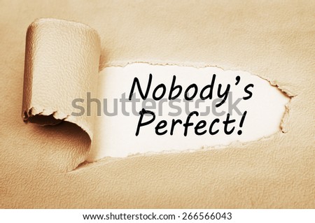 Nobody\'s Perfect written behind a torn paper. Motivation and self development concept