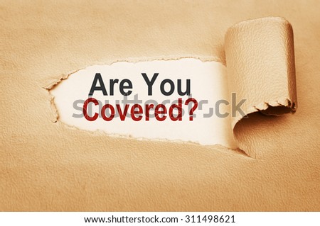 Are You Covered? written behind torn paper