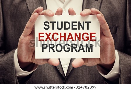 Student Exchange Program card in male hands