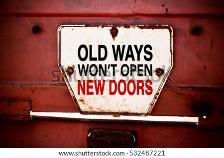 Old Ways Won\'t Open New Doors. Motivational quote. Innovation and creativity concept written on a grunge iron signboard